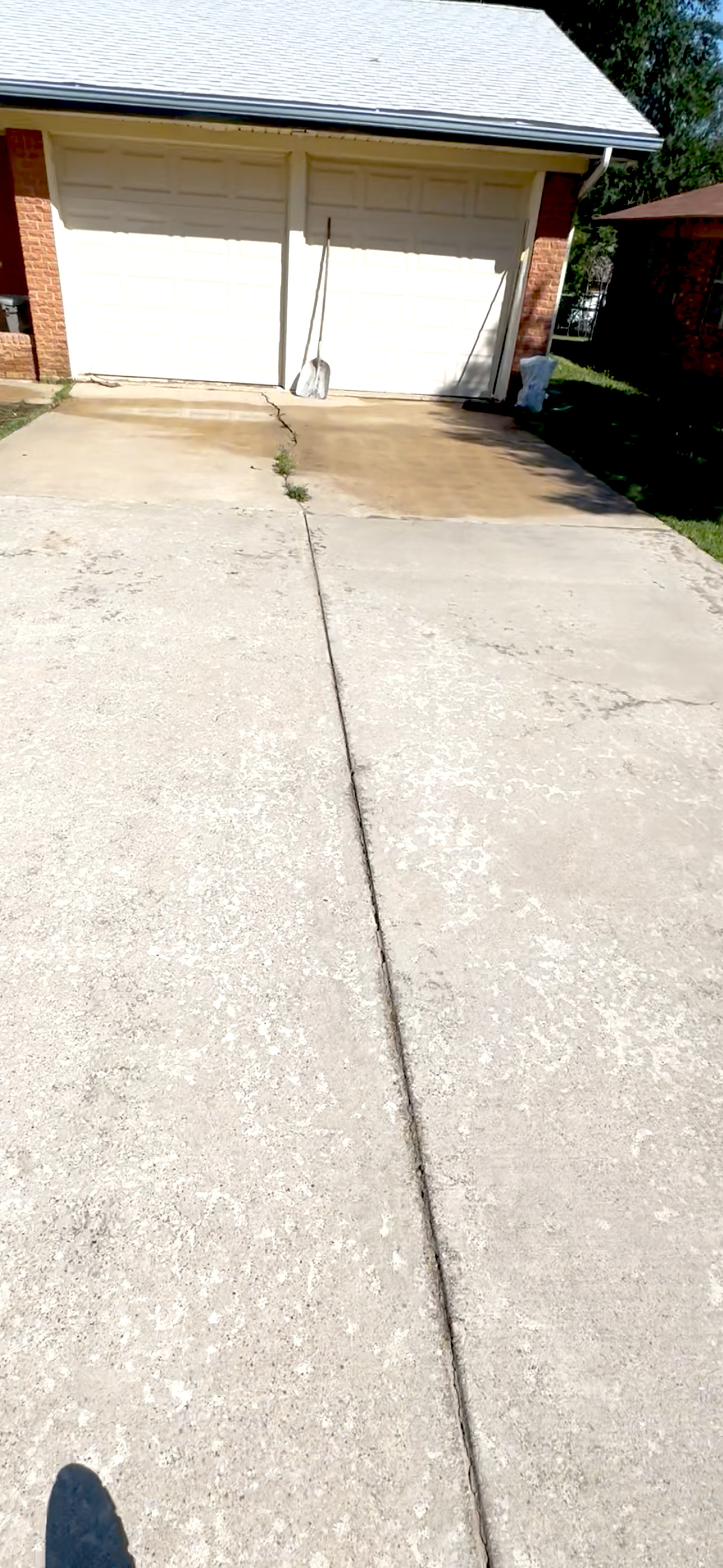 Clean concrete driveway after power washing