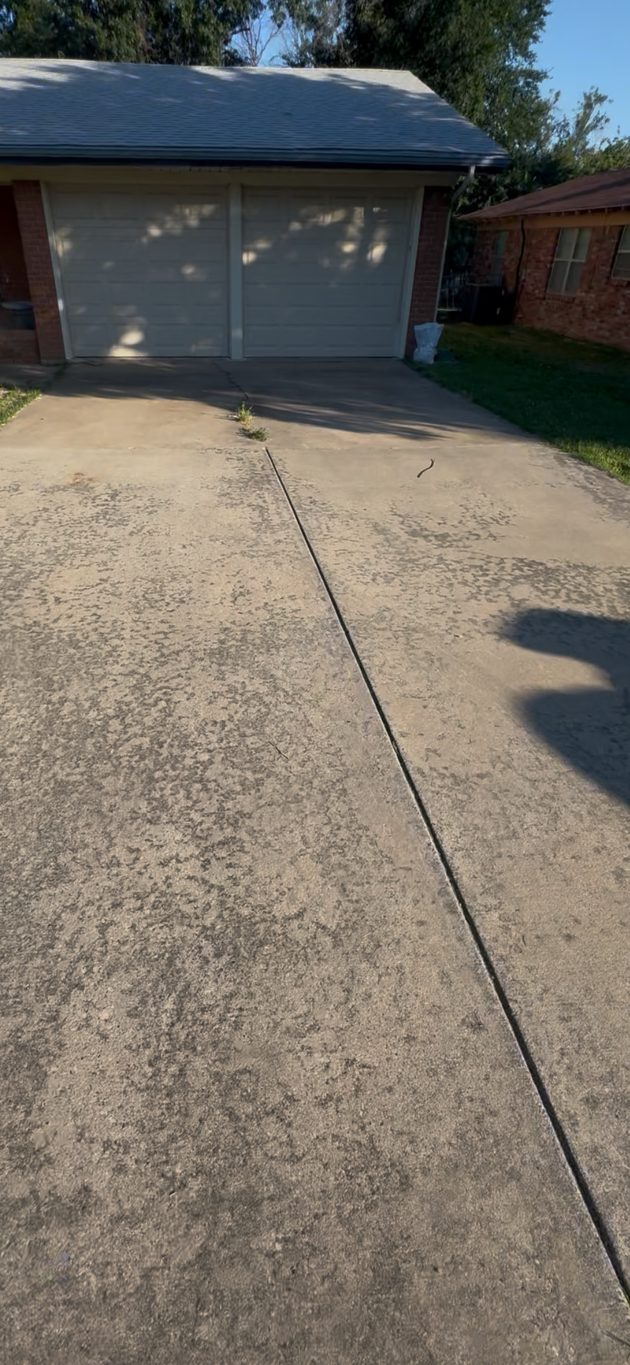 Stained concrete driveway before power washing